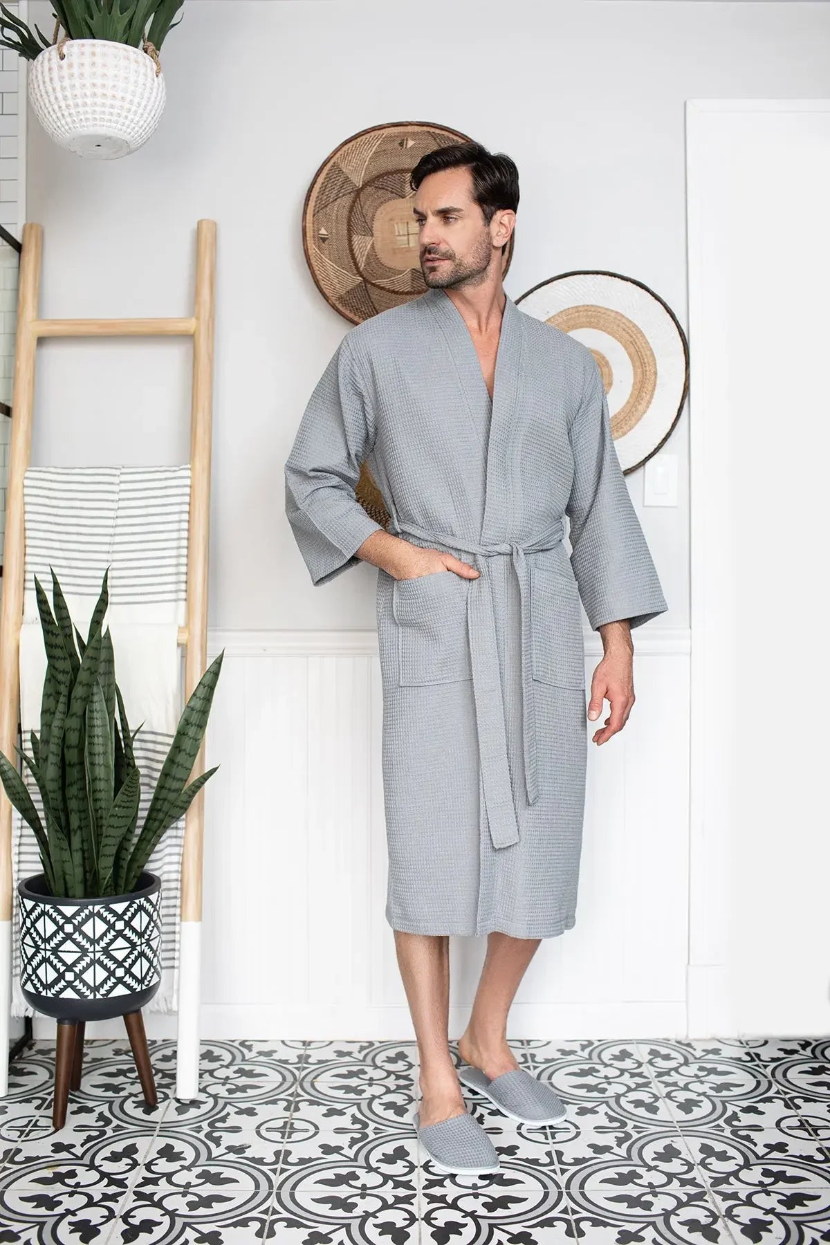 Gray Lotus Linen men's waffle spa bathrobe, lightweight and absorbent, shown hanging on a hook.