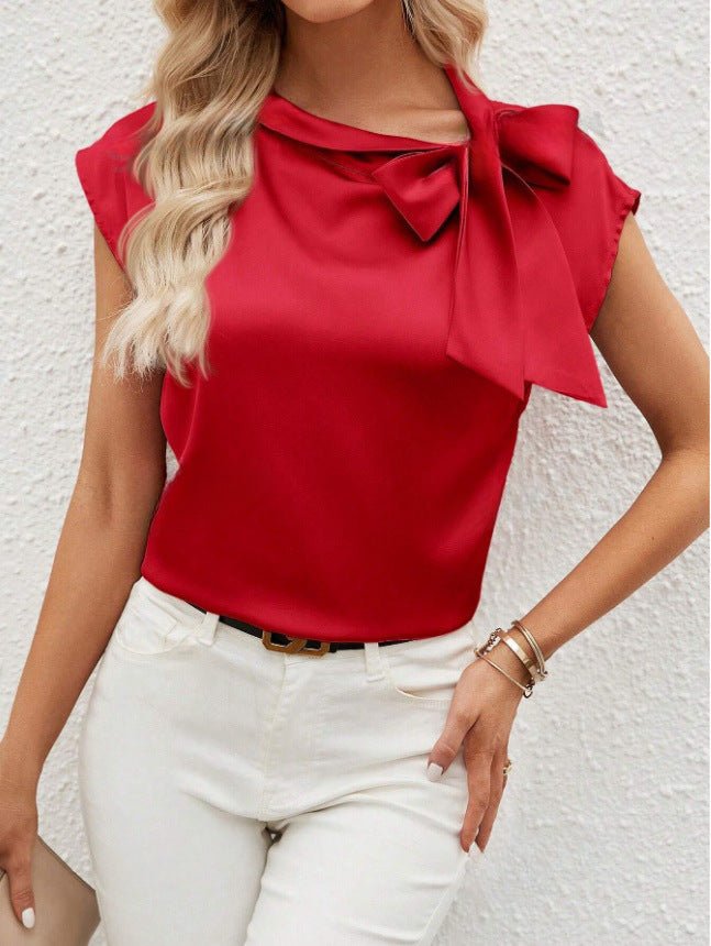 Bella Mia satin women's top with a half-open collar, bow detail, and special interest design, perfect for stylish casual wear.