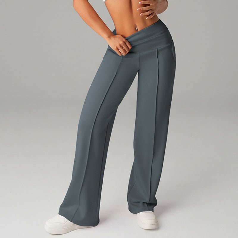 High-waisted loose-fitting wide-leg women's sweatpants in casualwear style, made by FitiqueFit, shown on a model.