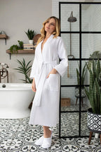 Lightweight Lotus Linen women's waffle robe with quick-dry spa comfort, shown with slippers for a relaxing spa look.