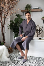 Men's lightweight Lotus Linen waffle spa bathrobe, absorbent and comfortable, shown in a relaxed fit on a model.