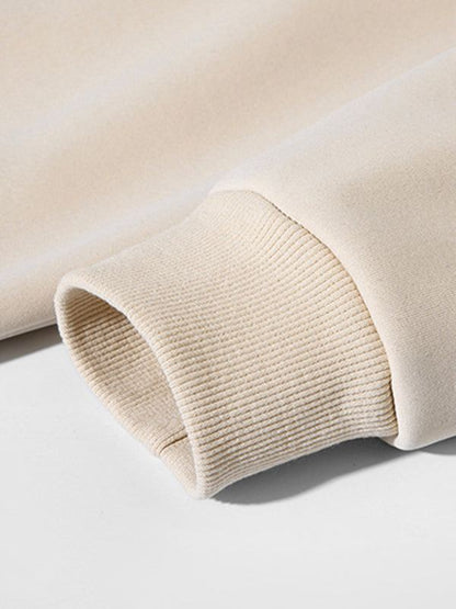 Men's solid color round neck long sleeve sweatshirt sleeve detail.