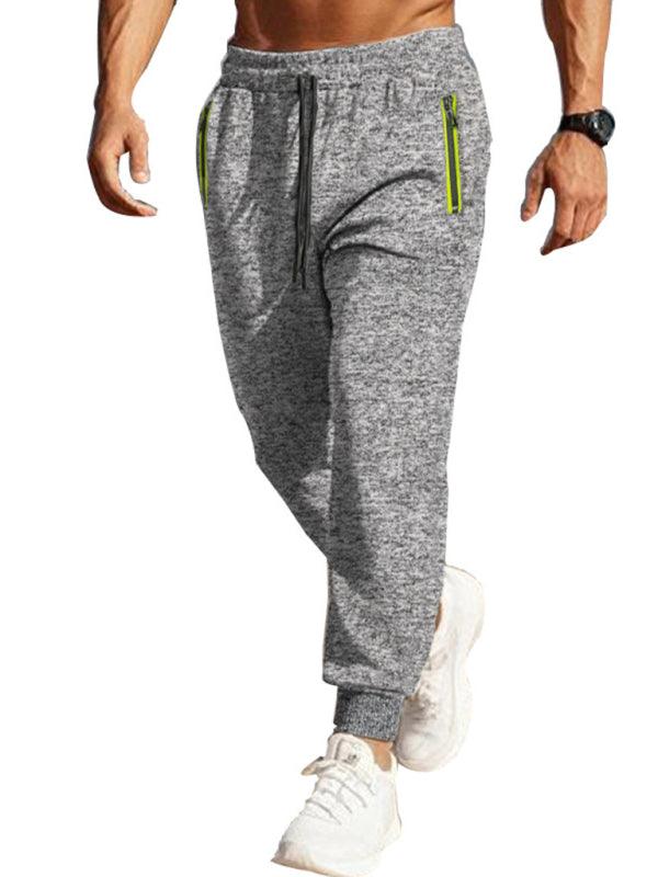 Men's casual cationic slim fit sports trousers with zipper cuffs and slant pockets.