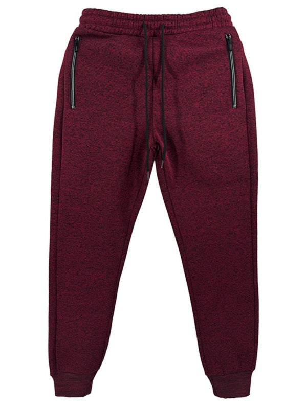 Men's sports casual cationic slim fit sweatpants with zipper cuffs and pockets.