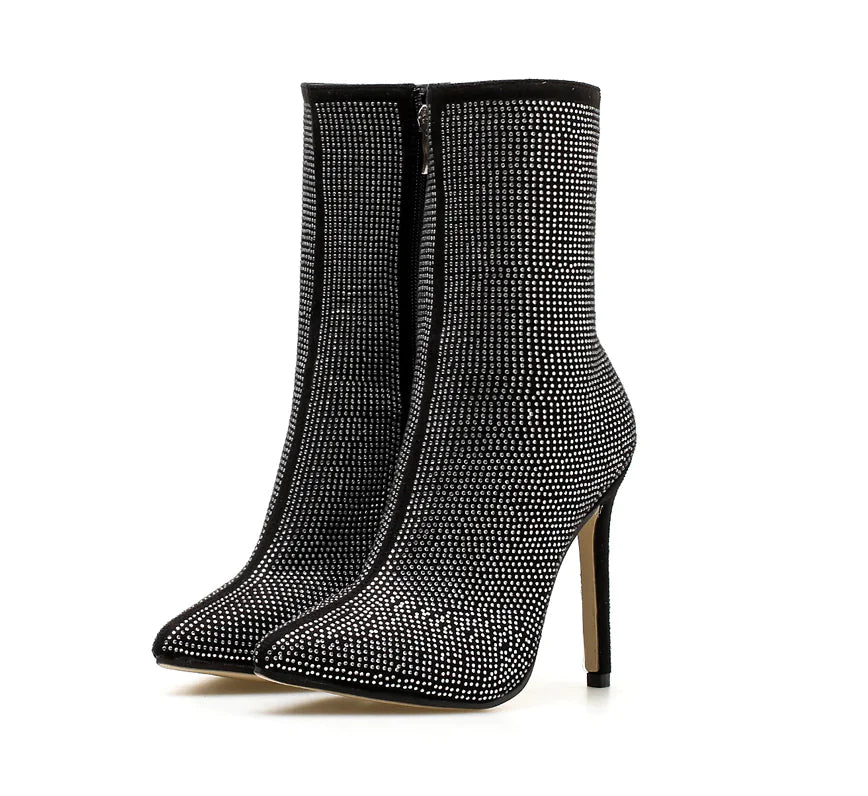 Elegant women's rhinestone high heel boots with pointed toes, featuring sparkling embellishments and stylish design.