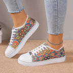 Low top floral canvas shoes for women from Trendy Attic Store01, featuring breathable design and colorful flower pattern.