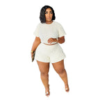 Plus size women's casual summer two-piece set featuring trendy shorts and relaxed top, stylish and comfortable for warm weather.