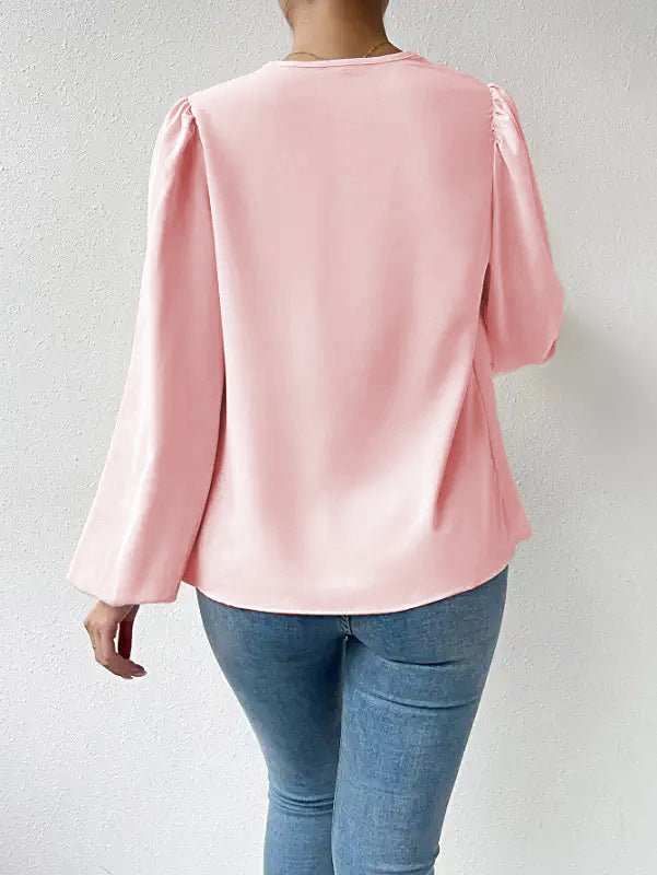 Loose draped long-sleeved V-neck top for women by Bella Mia, casual shirt with relaxed fit and stylish design.
