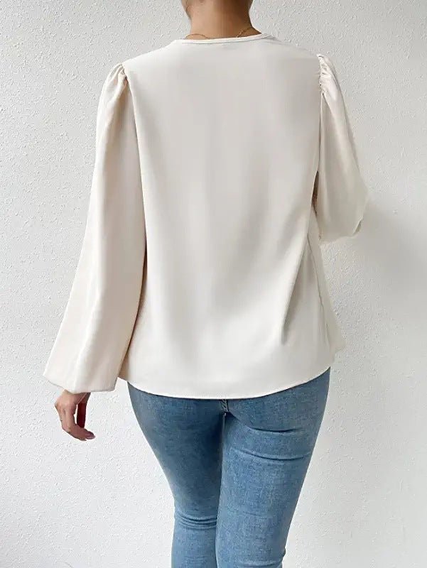 Bella Mia long-sleeved loose draped V-neck top for women, casual shirt with relaxed fit and elegant style.