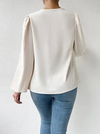 Bella Mia long-sleeved loose draped V-neck top for women, casual shirt with relaxed fit and elegant style.