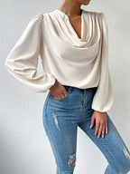 Loose draped V-neck long-sleeved shirt for women by Bella Mia, stylish casual top with relaxed fit and comfortable fabric.