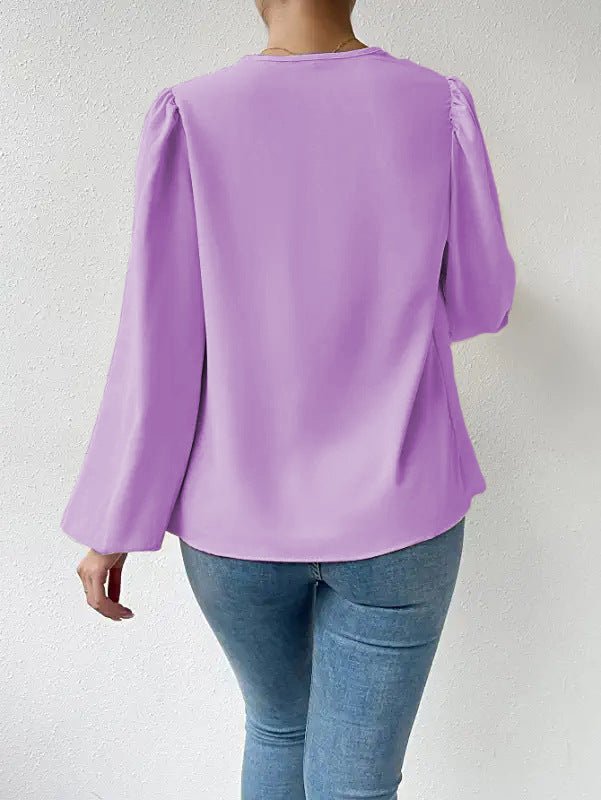 Bella Mia long-sleeved loose draped V-neck women’s top, casual T-shirt with relaxed fit and stylish design.