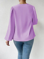 Bella Mia long-sleeved loose draped V-neck women’s top, casual T-shirt with relaxed fit and stylish design.