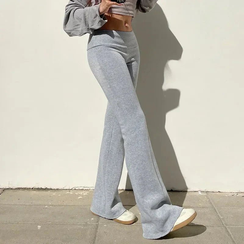 Low-waisted solid flare boot-cut pants for women by FitiqueFit, featuring a casual style with a flattering fit and wide-leg silhouette.