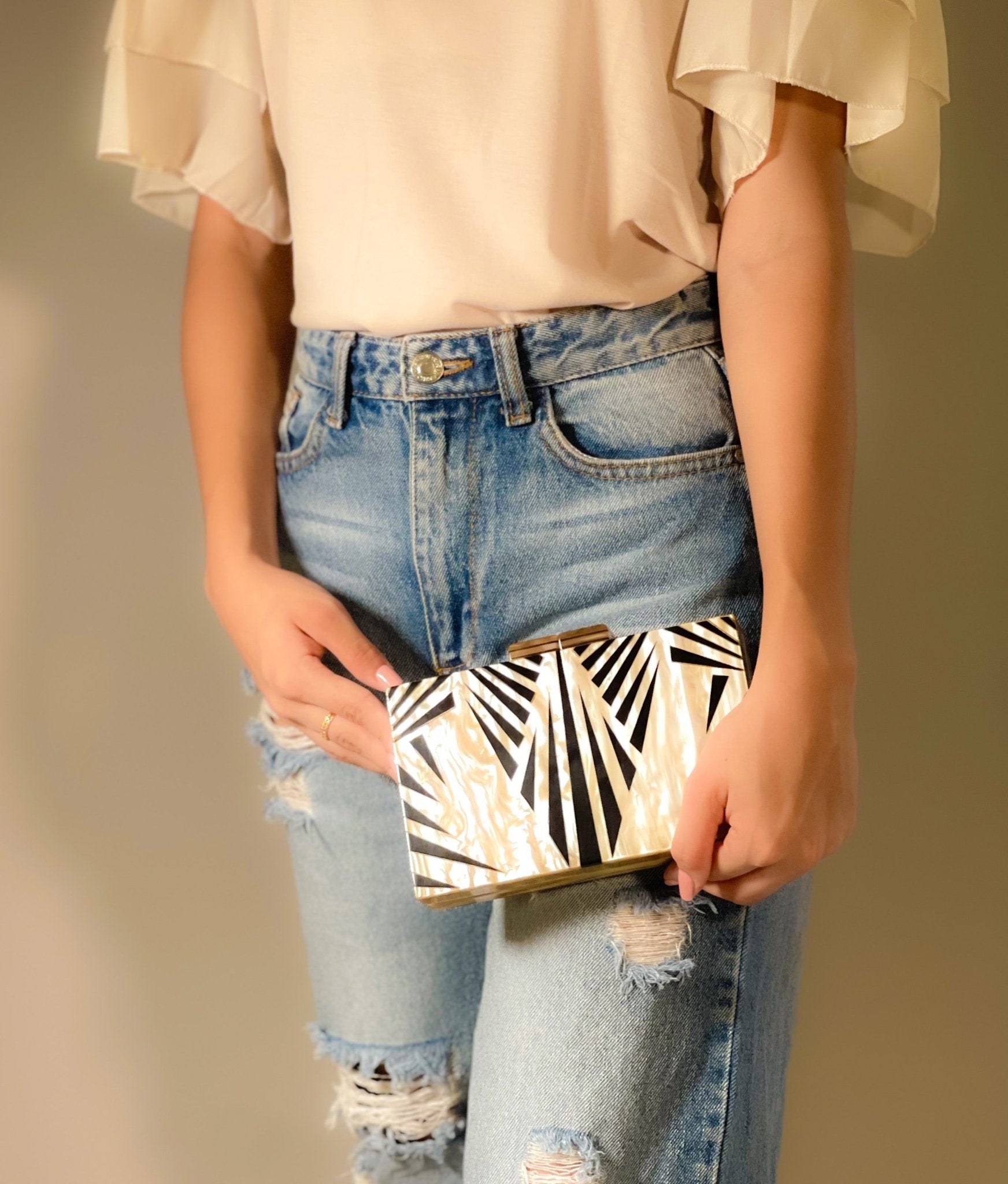 Black Luxe Clutch bag by Plush Fashion Hub, stylish evening bag with sleek design and elegant details.