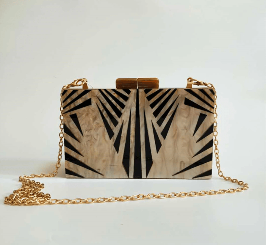 Black Luxe Clutch bag from Plush Fashion Hub with a sleek design, perfect for evening or formal occasions.