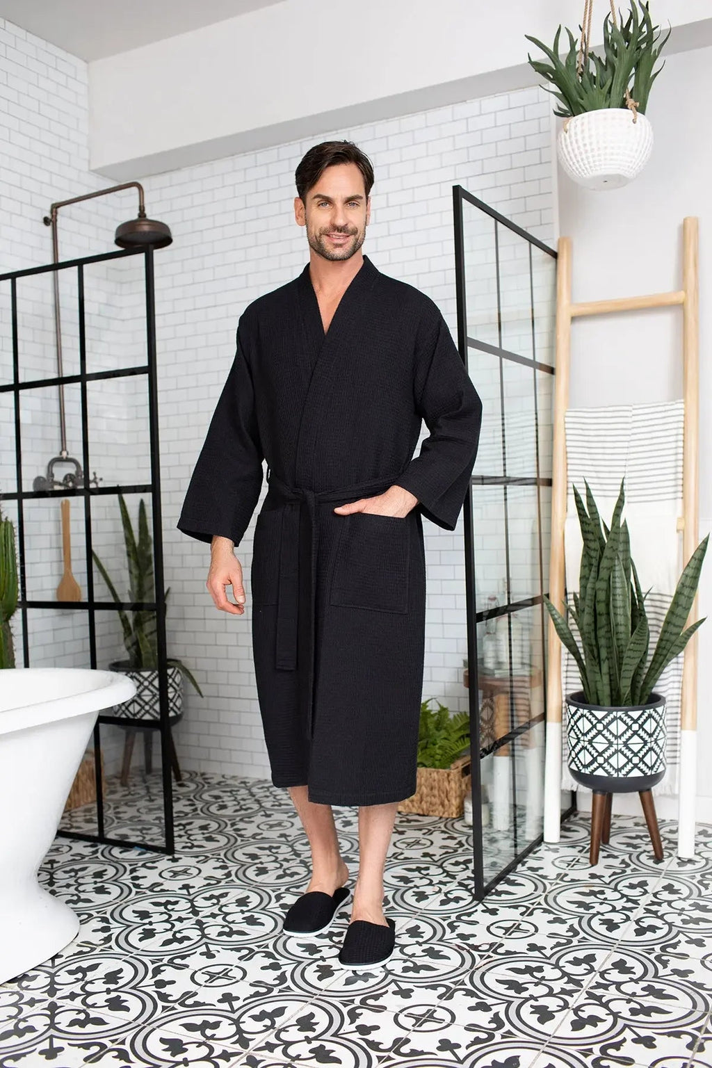 Men's Lotus Linen waffle spa bathrobe, lightweight and absorbent, shown hanging with a plush collar and tied waist.