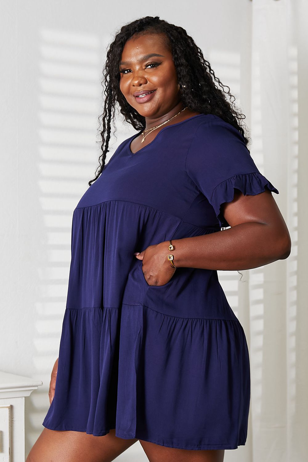 Women’s Mandy V-neck tiered dress with flounce sleeves by Plush Fashion Hub, casual style in a relaxed fit.