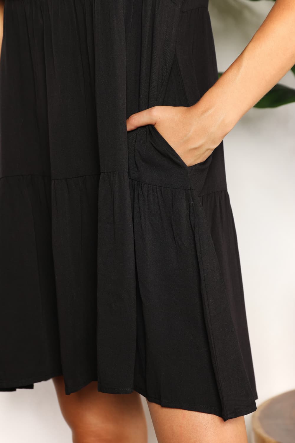Women’s Mandy solid V-neck casual dress with tiered flounce sleeves by Plush Fashion Hub, shown on a model with a relaxed fit.