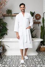 Men's Lotus Linen waffle spa bathrobe, lightweight and absorbent, shown in a relaxed fit with a shawl collar and tied waist.