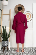 Men's Lotus Linen waffle spa bathrobe, lightweight and absorbent, shown hanging with a relaxed fit and textured fabric.