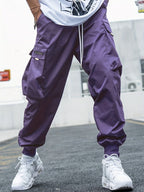 Men’s multi-pocket drawstring cargo pants from FitiqueFit, styled as streetwear, with multiple pockets and casual drawstring waistband.