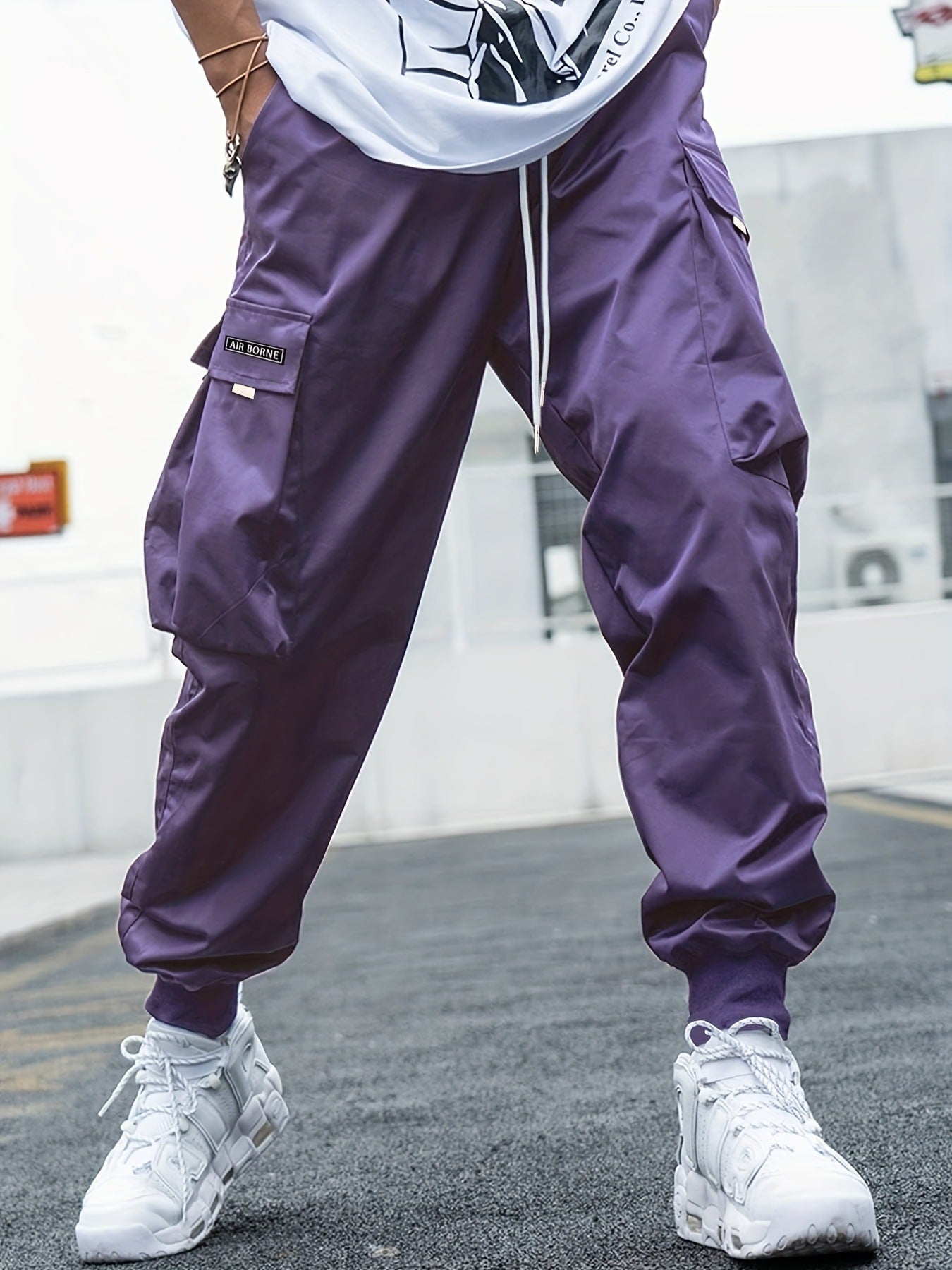 Men’s multi-pocket drawstring cargo pants from FitiqueFit, styled as streetwear, with multiple pockets and casual drawstring waistband.
