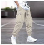 Men's multi-pocket drawstring cargo pants in streetwear style by FitiqueFit with multiple front and side pockets.
