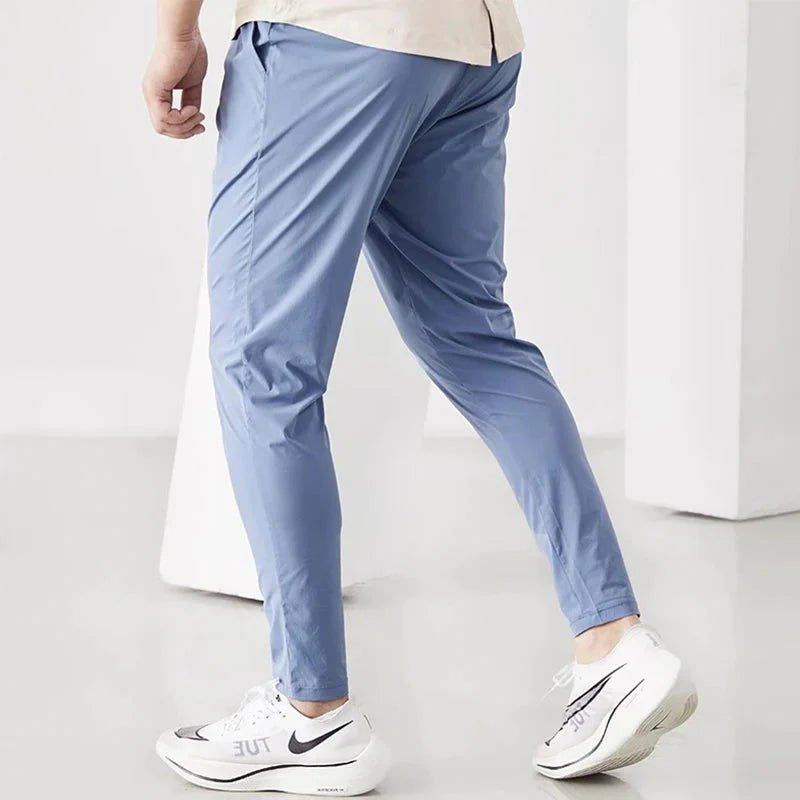 Men's black quick-dry running joggers by FitiqueFit, made for casual wear and active workouts, with a comfortable fit.