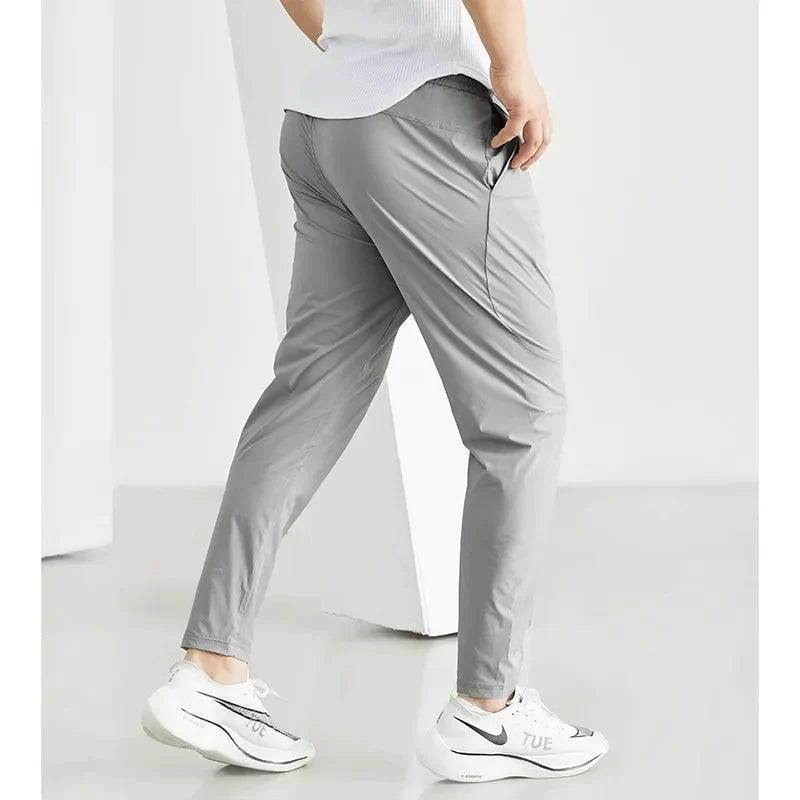 Men's black quick-dry running joggers from FitiqueFit, casual athletic wear with a comfortable fit and breathable fabric.