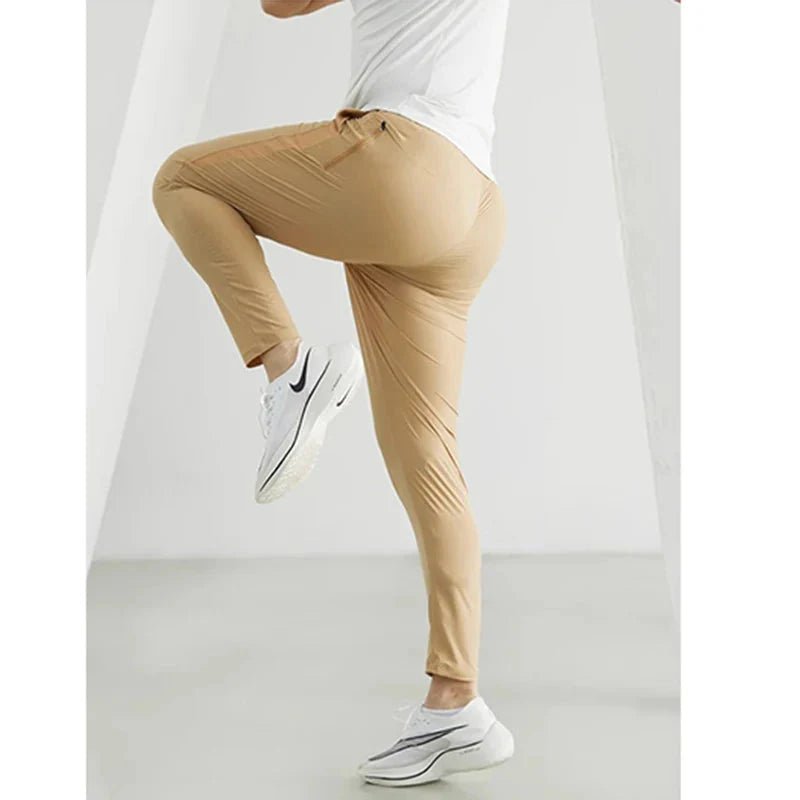 Black men's quick-dry running joggers by FitiqueFit, casualwear with a comfortable fit and lightweight fabric for active movement.