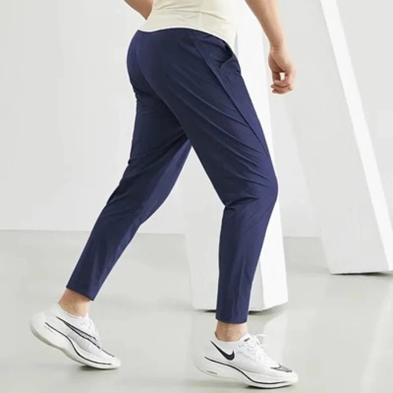 Black men's quick-dry running joggers by FitiqueFit, casualwear with athletic fit and breathable fabric for active wear.
