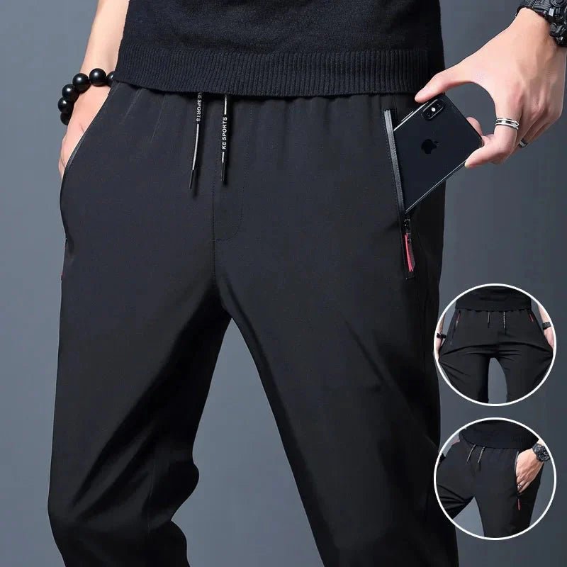 Men's stretch slim fit cargo jogger pants by FitiqueFit with elastic waist, casualwear style, shown in a relaxed fit with pockets.