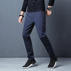 Men's stretch slim fit cargo jogger pants by FitiqueFit with elastic waistband, casualwear style, shown in a relaxed fit.