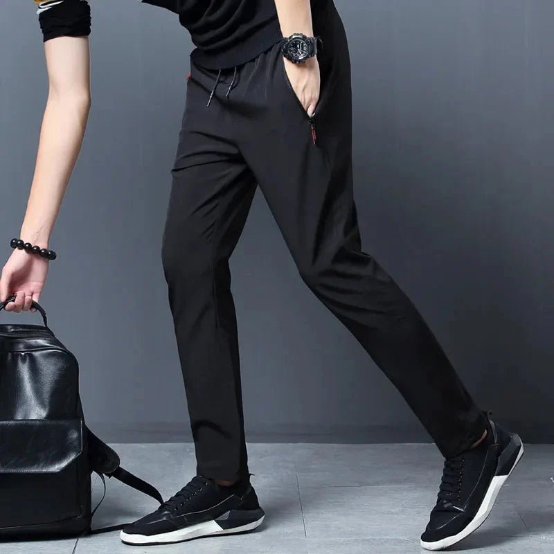 Men's stretch slim fit cargo jogger pants with elastic waist from FitiqueFit, casualwear featuring multiple pockets and tapered design.