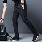 Men's stretch slim fit cargo jogger pants with elastic waist from FitiqueFit, casualwear featuring multiple pockets and tapered design.
