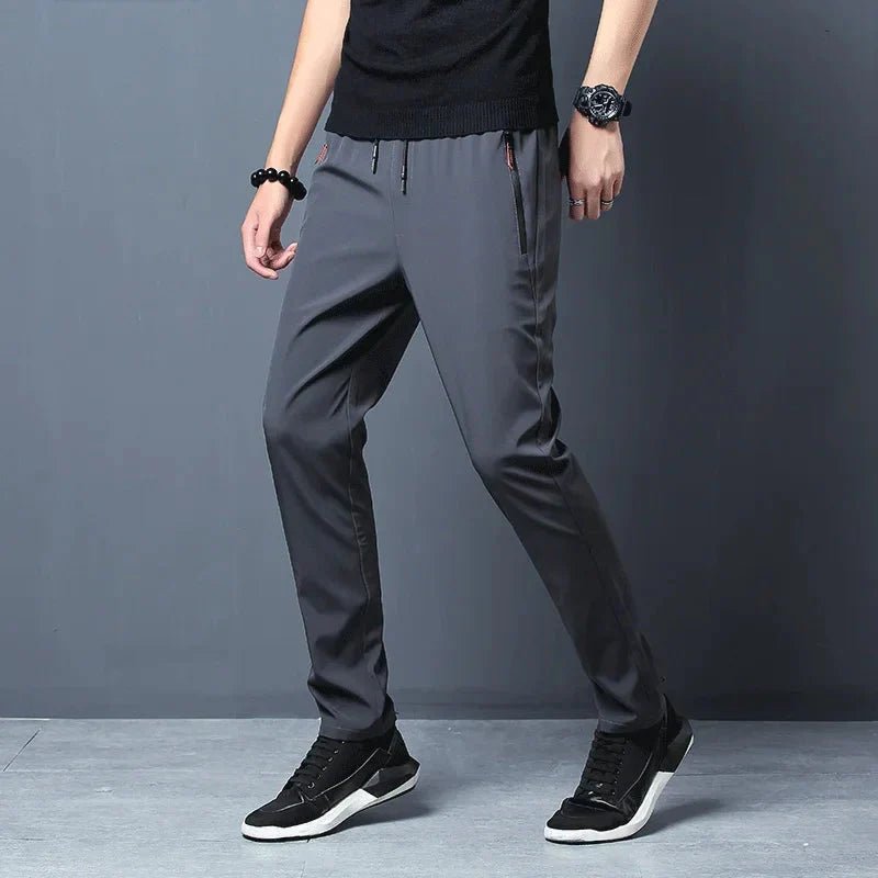 Men's stretch slim fit cargo jogger pants with elastic waist, casualwear by FitiqueFit, shown in a relaxed, comfortable fit.