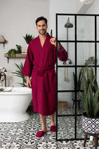 Men's Lotus Linen waffle spa bathrobe with absorbent, lightweight fabric, shown with matching slippers for comfortable relaxation.