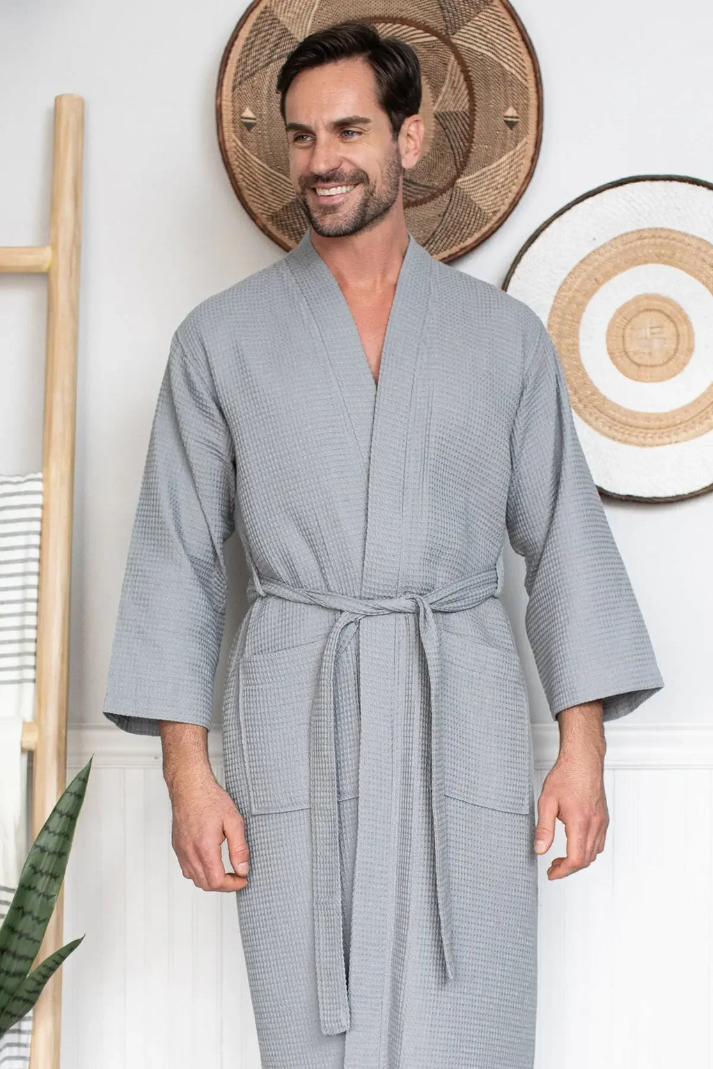 Men's waffle spa bathrobe by Lotus Linen, lightweight and absorbent, shown hanging with a relaxed fit and textured waffle fabric.
