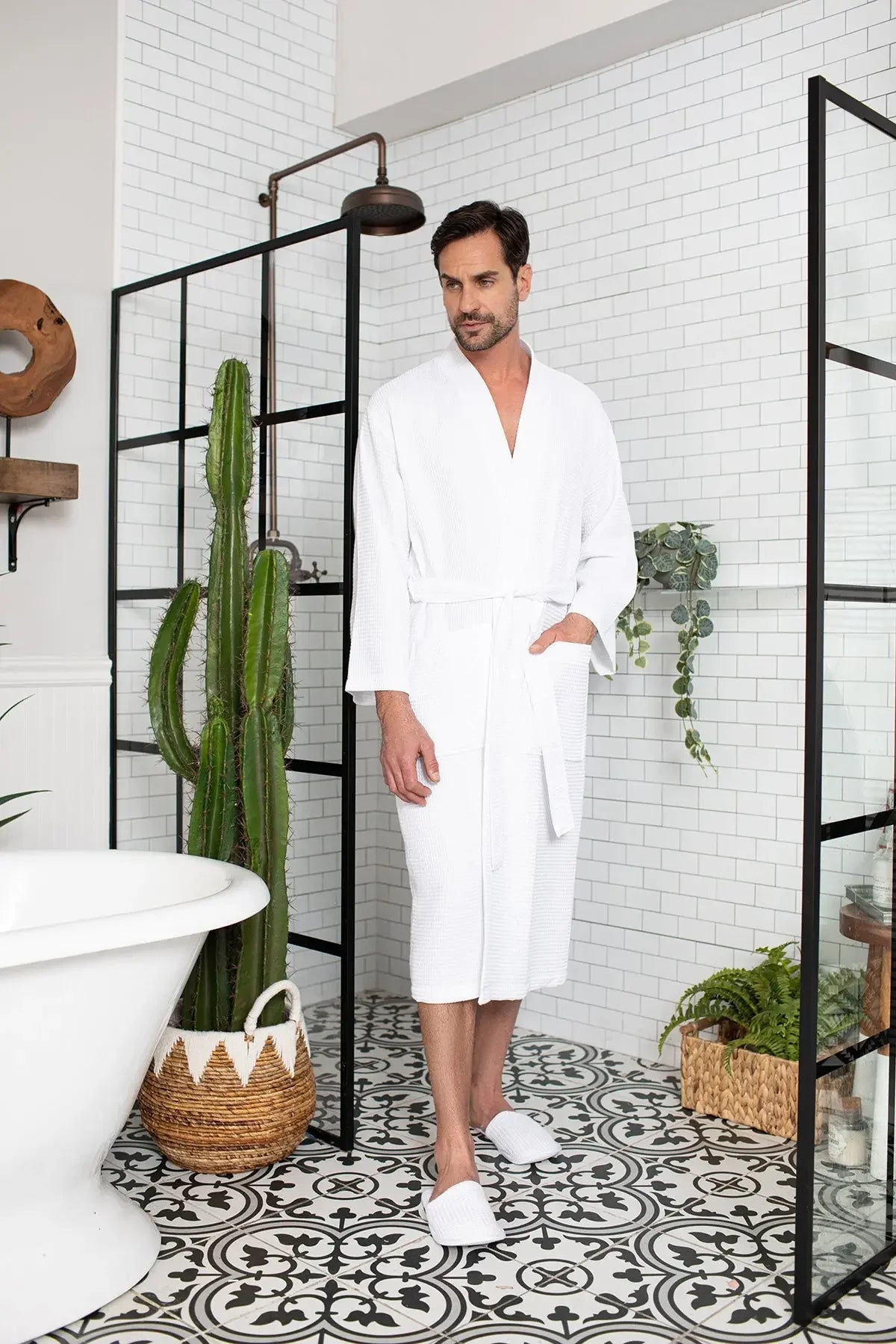 Men's waffle spa bathrobe by Lotus Linen, lightweight and absorbent, shown hanging with a relaxed fit and textured waffle fabric.