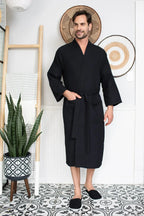 Men's lightweight Lotus Linen waffle spa bathrobe, absorbent and comfortable, shown hanging with a relaxed fit and textured fabric.