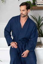 Men's waffle spa bathrobe by Lotus Linen, lightweight and absorbent, shown hanging with a relaxed fit and textured fabric.