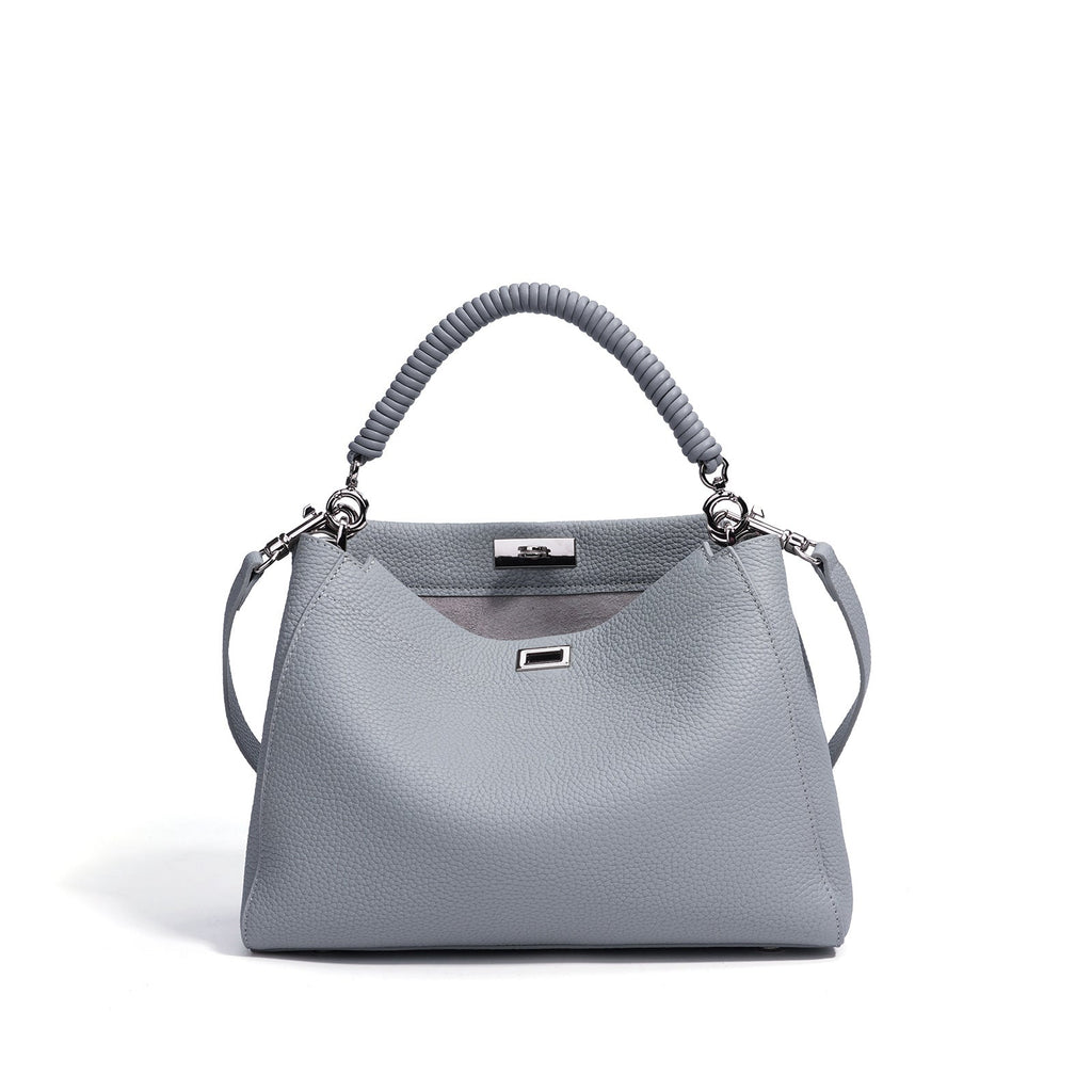 Motorcycle-style fashion large-capacity crossbody bag with multiple compartments, black and silver design, for women.