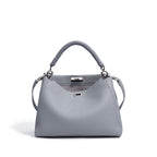 Motorcycle-style fashion large-capacity crossbody bag with multiple compartments, black and silver design, for women.