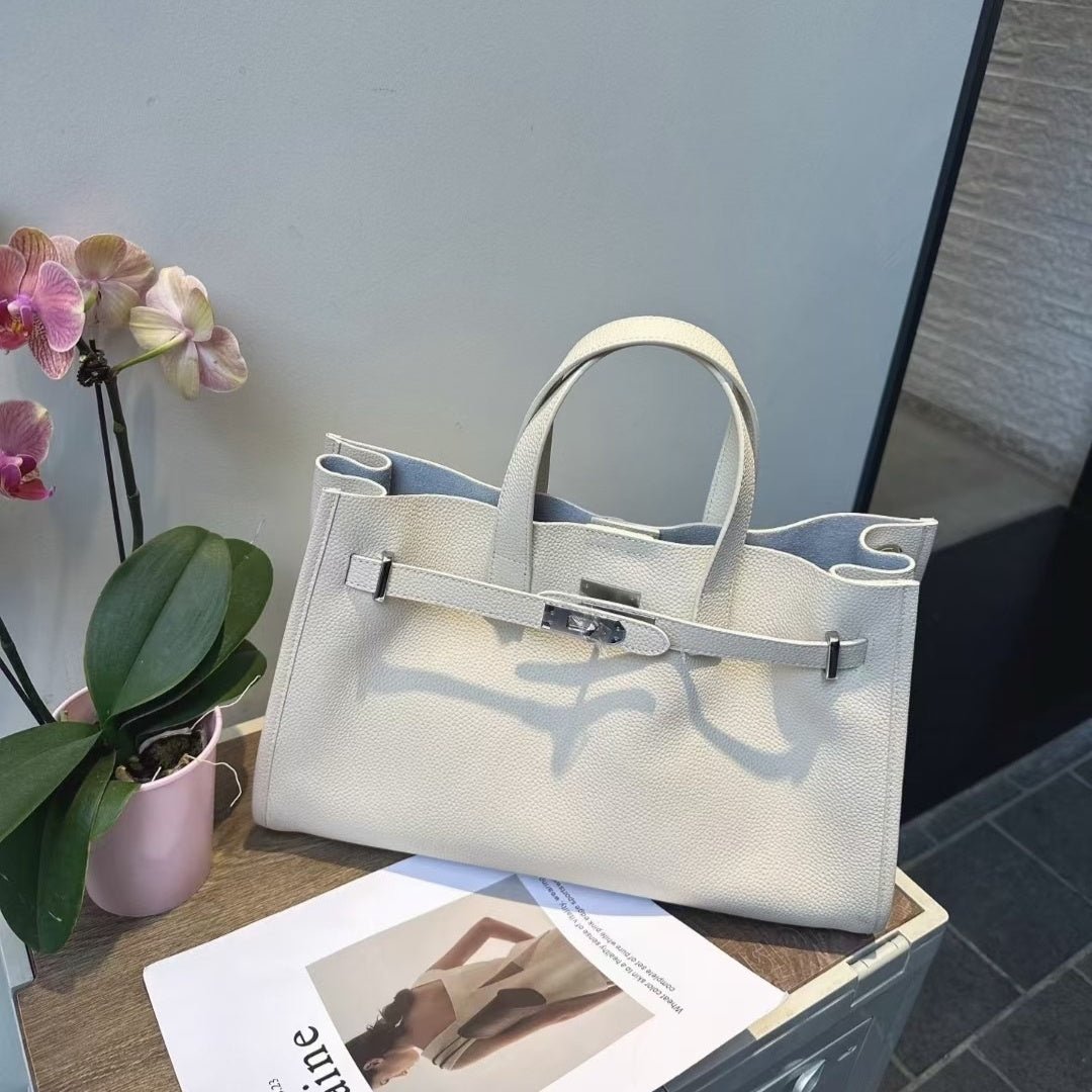 LadyShow.Store women's cowhide crossbody bag with adjustable strap, stylish all-match design, and top-layer leather finish.