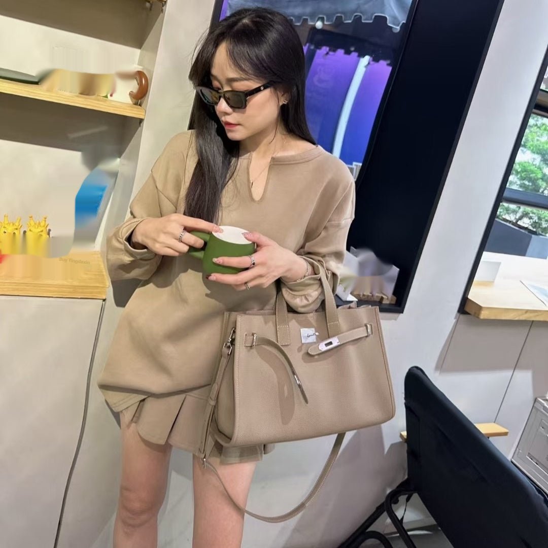 LadyShow.Store new top layer cowhide crossbody bag for women, stylish all-match design with adjustable strap and spacious interior.