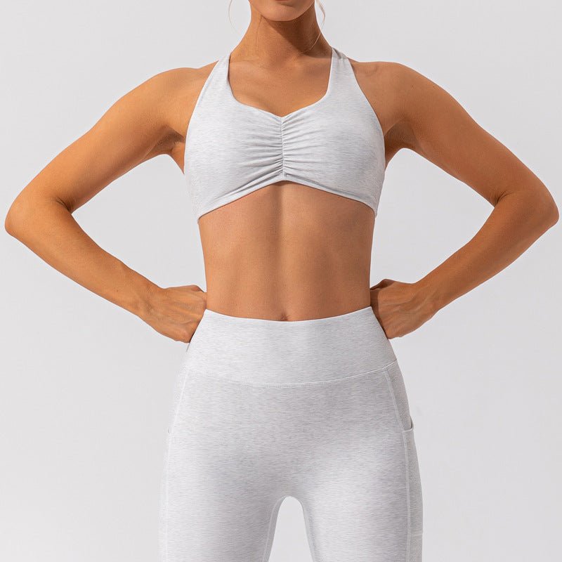 Nude Feel women's Pilates and yoga activewear set by FitiqueFit, featuring a seamless nude-colored sports bra and high-waisted leggings.