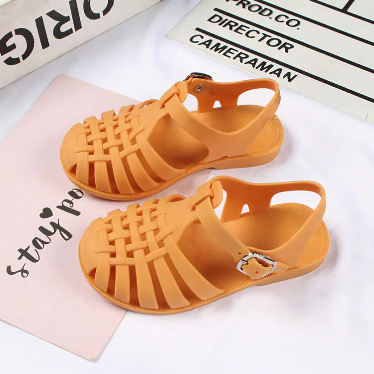 Girls hollow casual flat sandals in pink with open toes and strap details, from Trendy Attic Store01.
