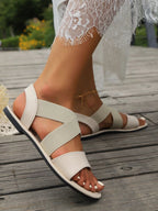 Women's breathable mesh open-toe flat sandals with lightweight casual design, featuring open-toe style and comfortable flat sole.