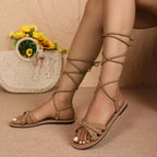 Women's open-toe lace-up flat sandals in faux leather, trendy and comfortable footwear by Trendsi.